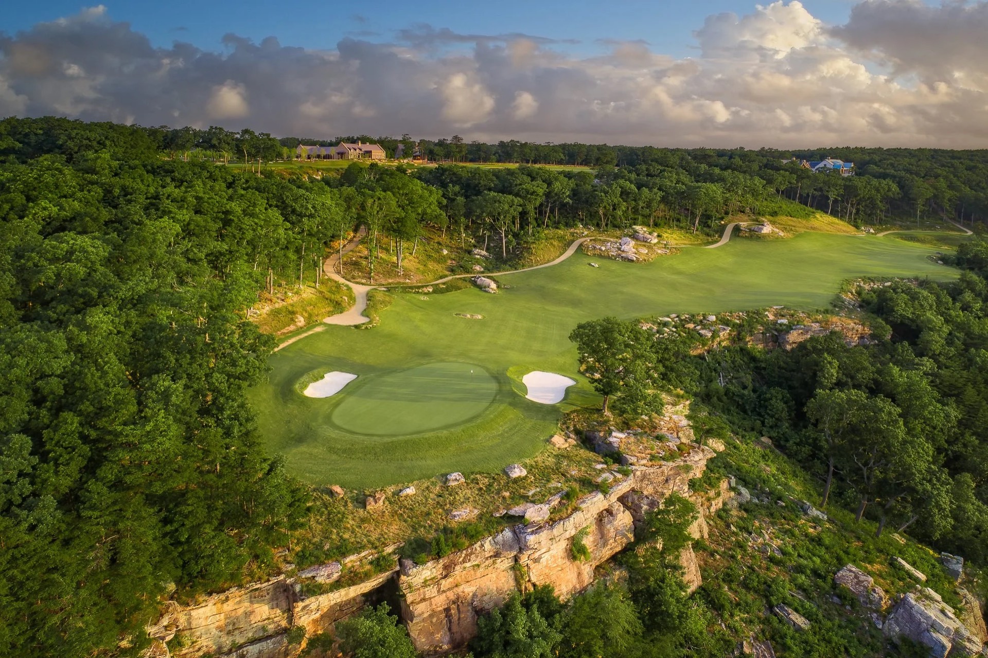 A championship green on the limestone escarpment at McLemore, the community beyond
